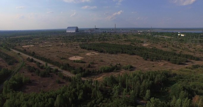 Chernobyl's arch. Aerial, 4K. The New Safe Confinement (NSC or New Shelter) is a structure intended to contain the nuclear reactor at Chernobyl, Ukraine