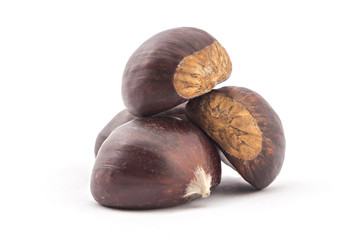 Pile of four fresh organic chestnuts isolated on white background