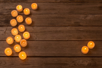 Fototapeta na wymiar candles on wooden background
