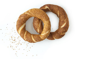 Two sesame bagels isolated on white