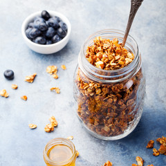 Healthy breakfast. Fresh granola, muesli with berries, honey 