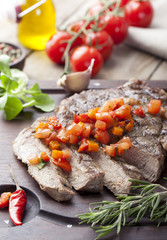 Beef steak well done with tomato and pepper salsa