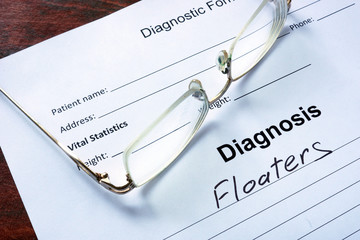 Diagnosis list with Floaters and glasses. Eye disorder concept.