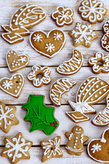 Christmas homemade gingerbread cookies on white wooden table 