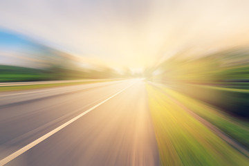 Empty asphalt road in motion blur and sunlight with vintage tone © tortoon