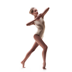 young beautiful dancer in beige swimsuit 