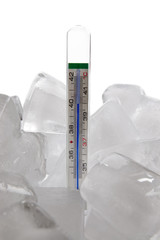 Reduce high fever. Medical thermometer showing high temperature in ice cubes.