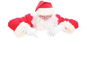 Kind Santa Claus looking out from behind the blank sign isolated on white background with copy space