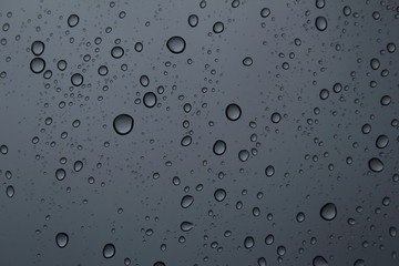 Rain on a window during a summer storm.