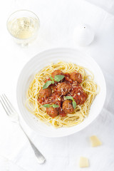 Meatballs in tomato sauce and fresh basil with spaghetti 