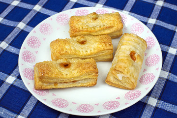 Homemade cakes puff pastry with apricot filling