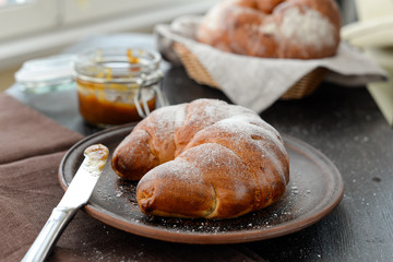 delicious breakfast with fresh croissants and jam