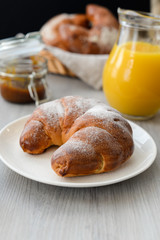 delicious breakfast with fresh croissants and orange juice