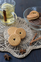Cream cookies with vanilla and chocolate with tea