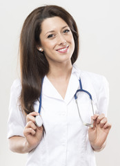 doctor with smile at gray background in studio