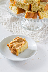 Corn bread cut in peaces on white wood background
