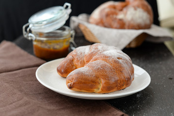 delicious breakfast with fresh croissants and jam