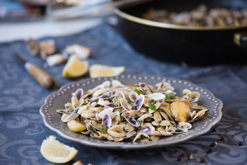 Stir fried clams with roasted paste,garlic, lemon, cilantro