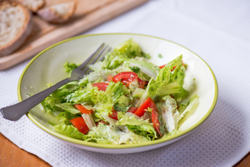 salad with lettuce leaves, cucumber and tomatoes