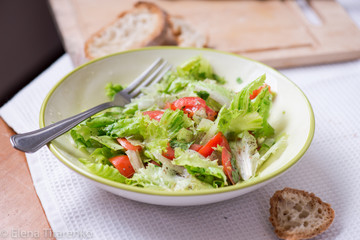 salad with lettuce leaves, cucumber and tomatoes