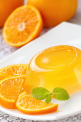 Fototapeta na wymiar Fruit jelly with fresh oranges