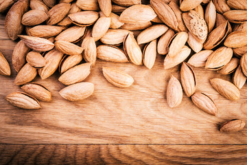 Almonds on wooden background