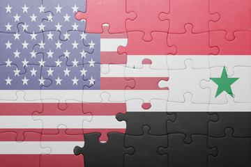 puzzle with the national flag of united states of america and syria