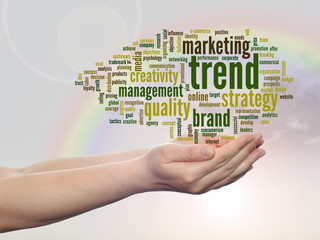 Conceptual business word cloud over rainbow