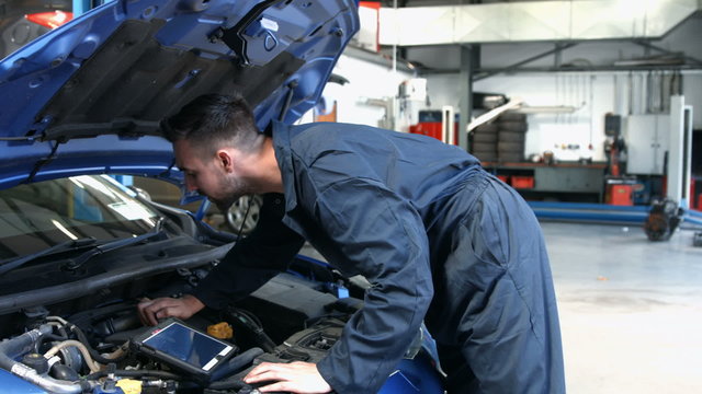 Mechanic overhauling an engine