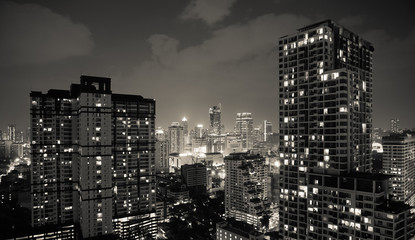 Cityscape night scene of capital city center. Condominiums, towers, and business building exterior architecture concept