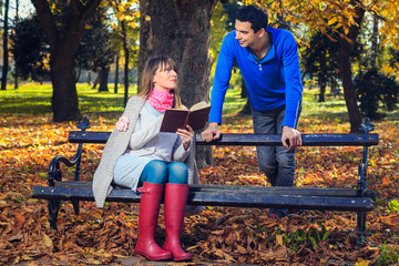 Young woman and a young man on a date in the park