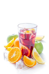 Sangria and ingredients on white wood background