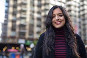 Indian woman in city smiling face