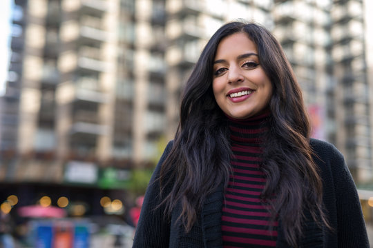 Indian woman in city smiling face