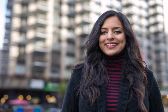 Indian woman in city smiling face