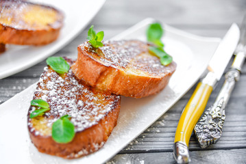 French toast -  fried bread toast with powdered sugar and mint