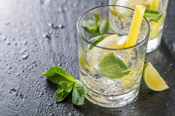 Lemonade ingredients on dark stone background