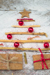 Christmas tree made of cardboard gift on wood background