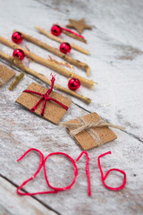 Christmas tree made of cardboard gift on wood background