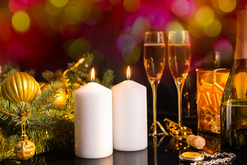 Lit Candles and Champagne in Festive Still Life
