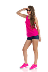 Fototapeta premium Woman Looking Away. Full length studio shot isolated on white.