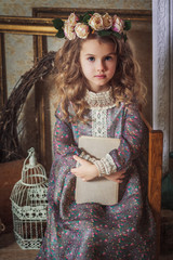 Fototapeta na wymiar Small beautiful girl dressed in retro style