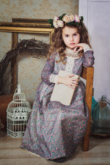 Small beautiful girl dressed in retro style