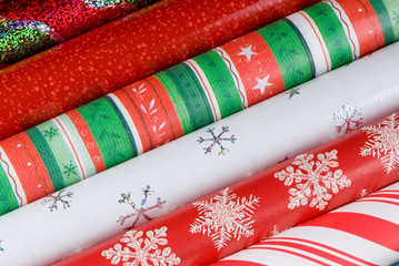 Rolls of Holiday Gift Wrap Paper.
