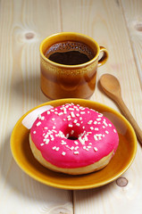 Coffee cup and donut