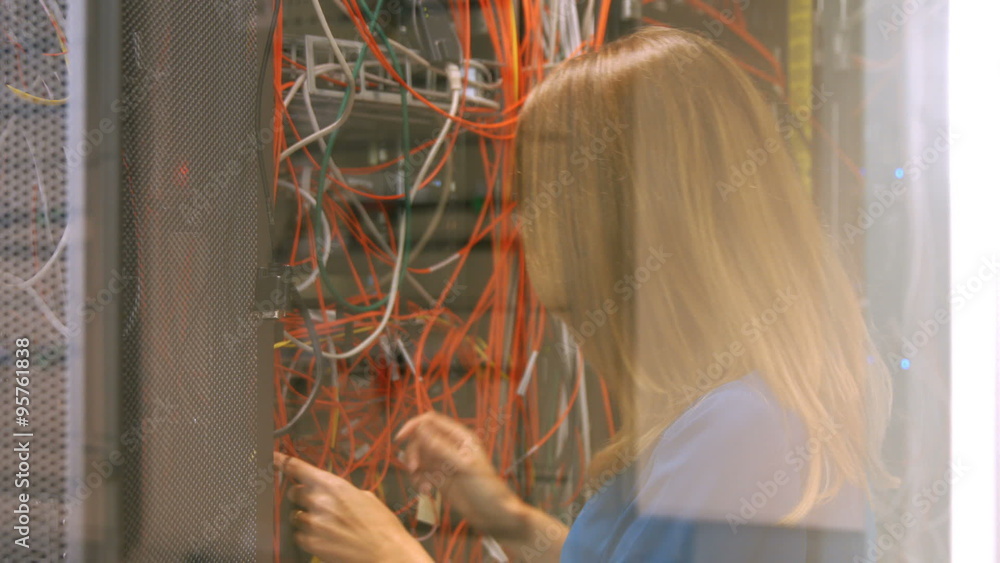 Poster Technician looking at open server locker