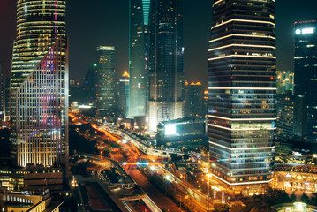 Fototapeta na wymiar Traffic Lights, Skyscrapers in Shanghai Downtown at Night