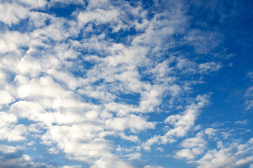 white clouds on a blue background