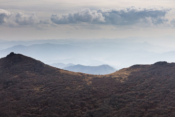 Obraz premium Fuzzy mountains around Gwangju with autumn colours