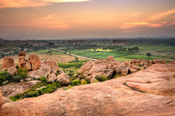 Picturesque view from the Malyavanta Hill at sunset overcast sky in Hampi, Karnataka, India.